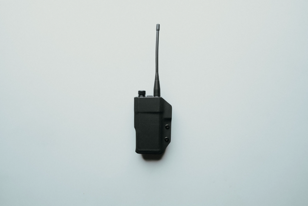 Hytera HP682 DMR radio in black kydex holster