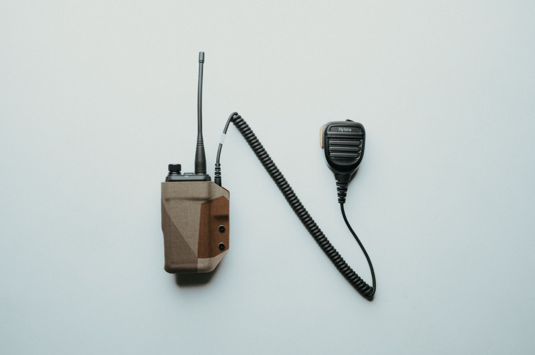 Hytera HP682 DMR radio in camo kydex holster with speaker mic